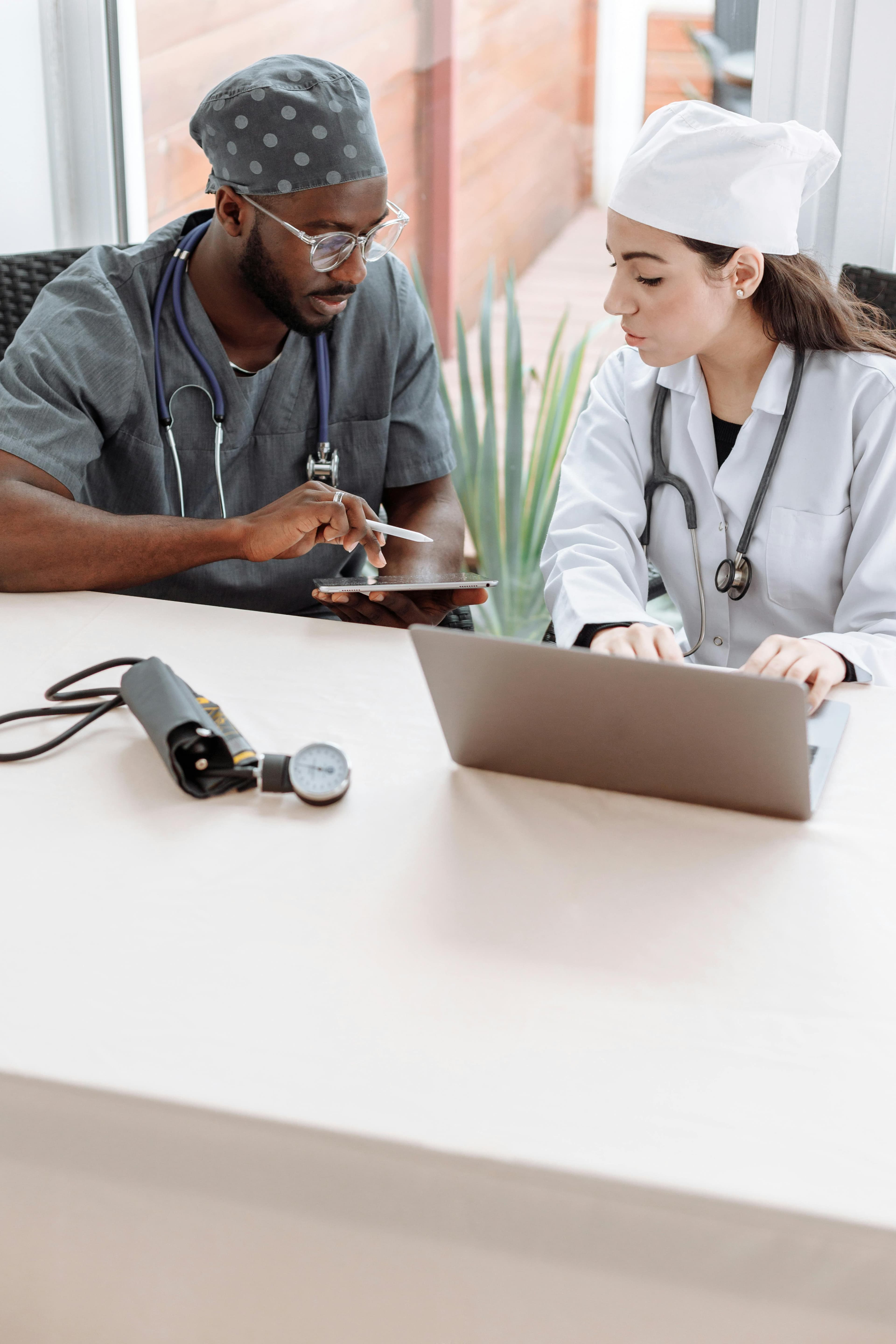 Receptionist welcoming patient in modern lobby